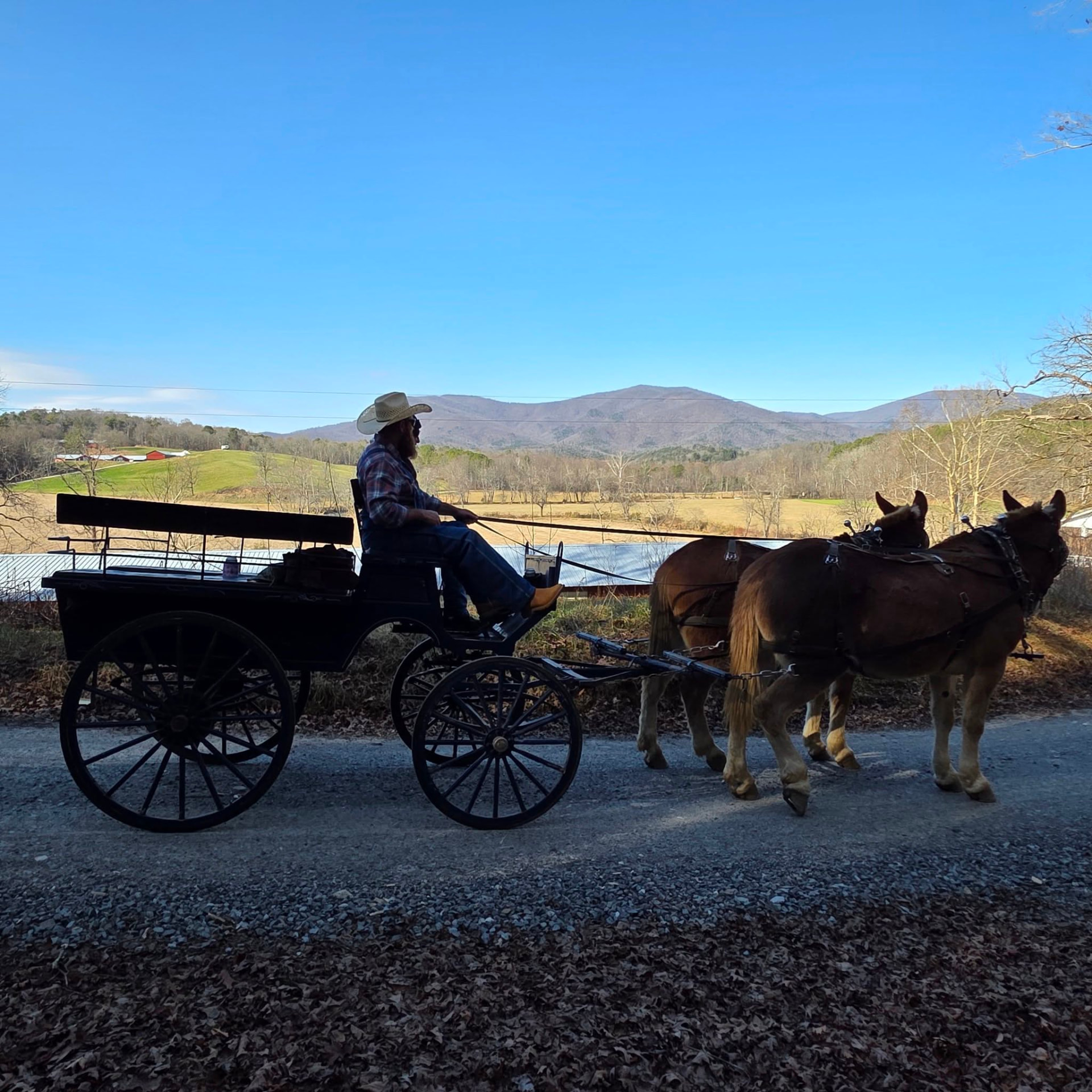 Jason driving Jim and Joe along a ridge road with mountain views